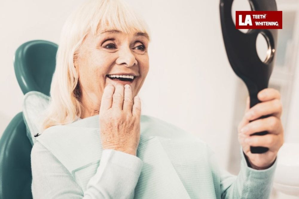 older person smiling, showing natural yellowing of teeth due to aging Borehamwood